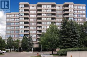 Vaughan (Crestwood-Springfarm-Yorkhill) condo for rent - A large apartment building with a parking lot in front.