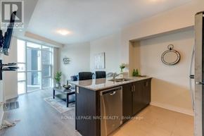 Grimsby (Grimsby Beach) condo for rent - A modern kitchen with a dining table and chairs.