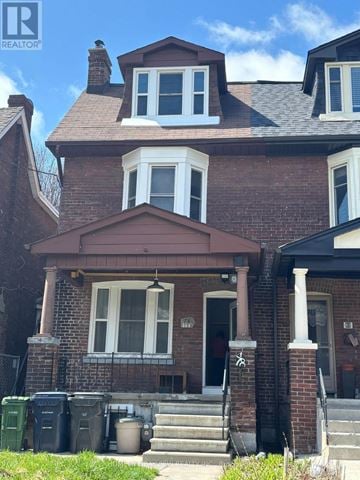 Toronto (Danforth) apartment for rent - A kitchen with white cabinets and appliances.