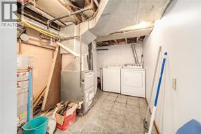 Windsor apartment for rent - A room with a lot of white appliances and a blue bucket on the floor.