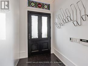 Toronto (Annex) apartment for rent - A black door with a glass window and a stained glass window above it.