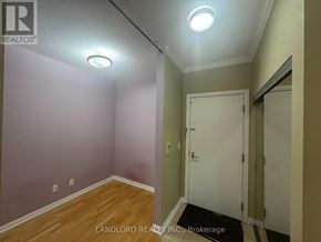 Toronto (Bay Street Corridor) condo for rent - A room with a white door and a light on the ceiling.