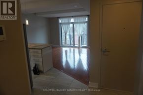 Ottawa apartment for rent - A brokerage office with a desk and a window with curtains.