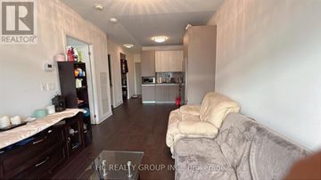 Richmond Hill (Doncrest) condo for rent - A living room with a couch and a coffee table.
