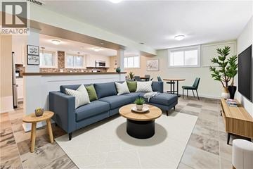 Burlington apartment for rent - A living room with a blue couch and a coffee table.