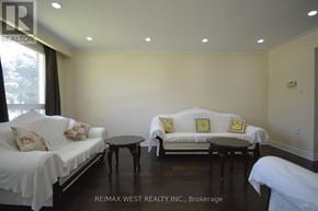 Toronto (West Humber-Clairville) apartment for rent - A living room with white couches and a black coffee table.