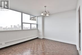 Toronto (Don Valley Village) condo for rent - A room with a window overlooking a cityscape.