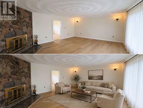 Clarington apartment for rent - A living room with a stone fireplace and a couch.