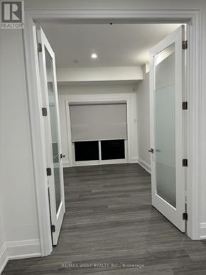 Toronto (Humber Summit) apartment for rent - A hallway with white walls and a wooden floor.