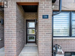 Toronto (Bendale) townhouse for rent - A brick building with the number 136 on it.
