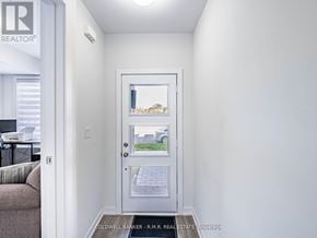 Toronto (Bendale) townhouse for rent - A white door with a picture of a house on it.