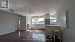 Toronto (East End-Danforth) apartment for rent - A room with a desk and a window with blinds.