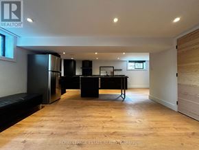 Toronto (Kennedy Park) apartment for rent - A spacious room with a black piano and a bench.