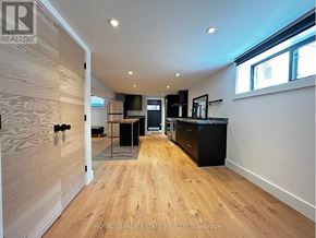 Toronto (Kennedy Park) apartment for rent - A spacious kitchen and living room with wooden floors and modern appliances.