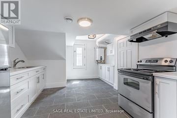 Hamilton (Kirkendall) apartment for rent - A kitchen with a stove top oven and a sink.