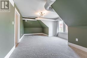 Hamilton (Kirkendall) apartment for rent - A room with a carpet floor and a ceiling fan.