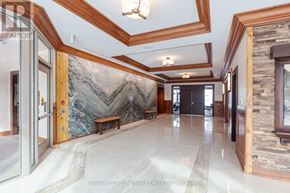 Ottawa condo for rent - A hallway with a marble floor and a large mountain mural on the wall.