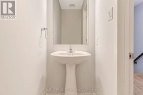 Ottawa townhouse for rent - A white pedestal sink in a small bathroom.