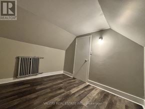 Windsor apartment for rent - A room with a wooden floor and a white door.