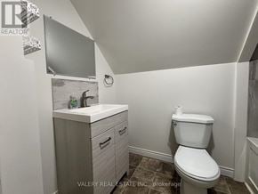 Windsor apartment for rent - A bathroom with a toilet, sink, and cabinet.