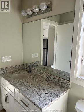 Windsor apartment for rent - A bathroom with a sink and a mirror.