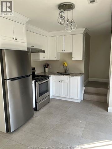 Windsor apartment for rent - A kitchen with white cabinets and a stainless steel refrigerator.