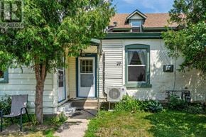 Smiths Falls apartment for rent - A house with a tree in front of it.