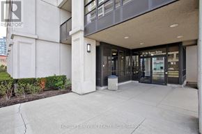 Toronto (York University Heights) condo for rent - A hallway with a brokerage sign on the door.