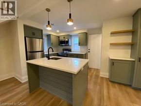 Stratford apartment for rent - A kitchen with a white countertop and wooden floors.