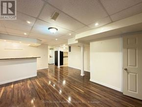 Richmond Hill (Westbrook) apartment for rent - A room with wooden floors and white walls, with a door on the right side.