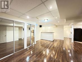 Richmond Hill (Westbrook) apartment for rent - A spacious room with wood flooring and a white ceiling.