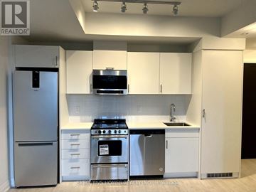 Oakville (Jm Joshua Meadows) condo for rent - A modern kitchen with white cabinets and stainless steel appliances.