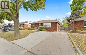 Windsor apartment for rent - A residential area with houses and trees.