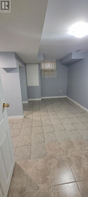 Toronto (O'connor-Parkview) townhouse for rent - A room with a tiled floor and a door.