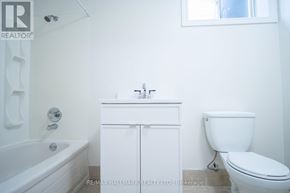 Toronto (Englemount-Lawrence) apartment for rent - A white bathroom with a toilet, sink and bathtub.