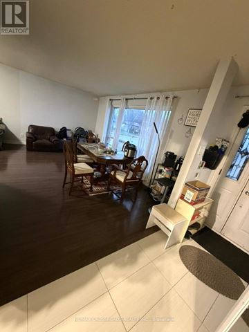 Toronto (Malvern) apartment for rent - A living room with a dining table and chairs.
