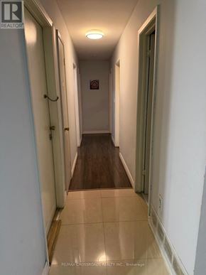 Toronto (Malvern) apartment for rent - A long hallway with a door on the left and a door on the right.