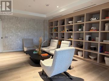 Mississauga (Cooksville) condo for rent - A living room with a black coffee table and a grey sofa.
