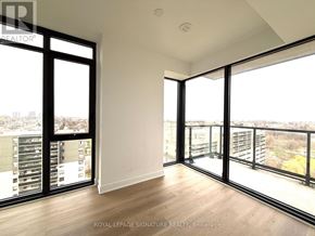 Mississauga (Cooksville) condo for rent - A room with a view of the cityscape through large windows.