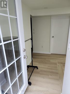 Toronto (Centennial Scarborough) apartment for rent - A brokerage sign is on the door.