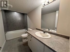 New Dundee apartment for rent - A bathroom with a sink, toilet, and bathtub.