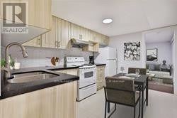 Toronto (Birchcliffe-Cliffside) apartment for rent - A kitchen with a sink, stove, and refrigerator.