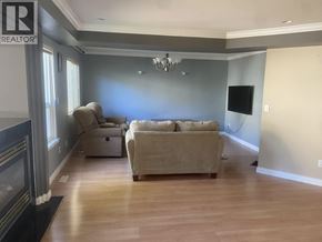 Coquitlam apartment for rent - A living room with a fireplace and a couch.