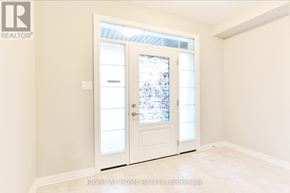 Ottawa apartment for rent - A white door with a glass window is in a room with white walls.