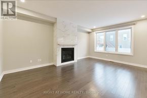 Ottawa apartment for rent - A spacious room with a fireplace and a large window.
