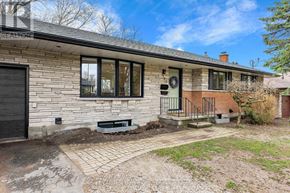 Centre Wellington (Fergus) apartment for rent - A house with a brick exterior and a black door is shown.