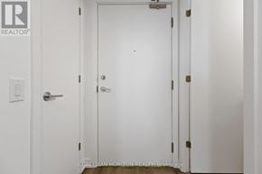Toronto (Rouge) condo for rent - A white door with a handle and a lock.