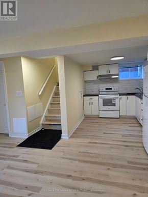 Hamilton (Bonnington) apartment for rent - A real estate listing photo of a home interior with a staircase leading to a second floor.