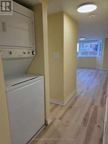 Hamilton (Bonnington) apartment for rent - A white dishwasher is in a kitchen with wood flooring.