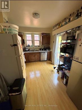 Kingston (Central City East) apartment for rent - A kitchen with wooden floors and a white refrigerator.